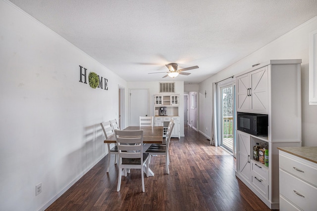 1315 Beaverbrook Dr, Holly, MI 48442 - dining area with a textured ceiling, a ceiling fan, baseboards, and dark wood-style flooring