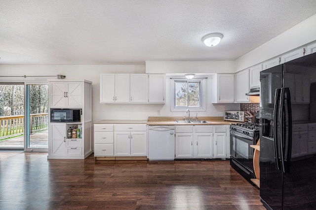 1315 Beaverbrook Dr, Holly, MI 48442 - kitchen with black appliances, white cabinetry, and a sink