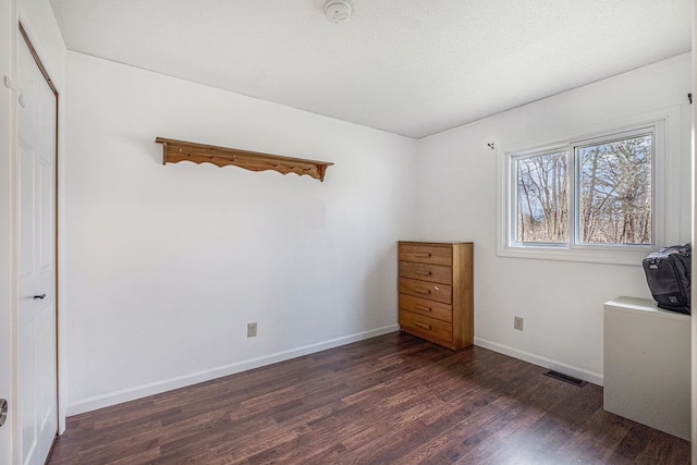 1315 Beaverbrook Dr, Holly, MI 48442 - bedroom with baseboards, wood finished floors, and visible vents