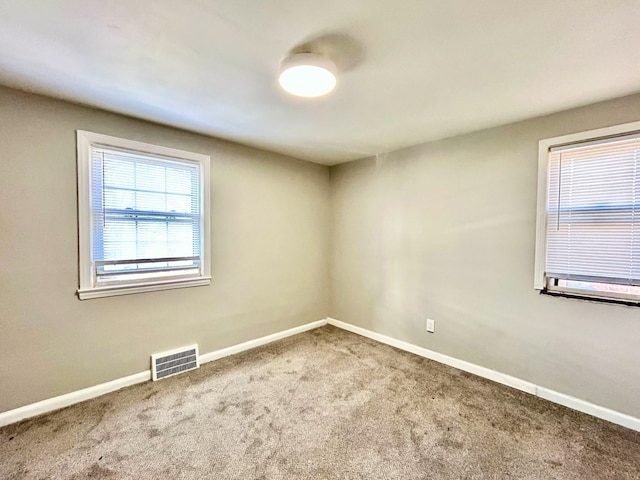 10342 Britain St, Detroit, MI 48224 - carpeted spare room with visible vents and baseboards