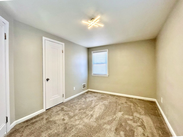 10342 Britain St, Detroit, MI 48224 - carpeted spare room with visible vents and baseboards