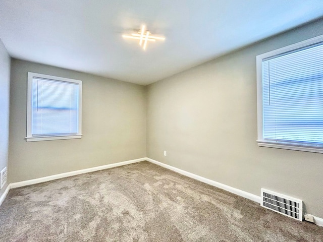 10342 Britain St, Detroit, MI 48224 - carpeted spare room with baseboards and visible vents
