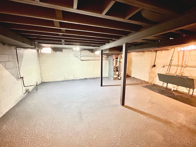 10342 Britain St, Detroit, MI 48224 - unfinished below grade area featuring heating unit and a sink