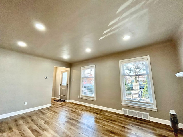 10342 Britain St, Detroit, MI 48224 - empty room with baseboards, visible vents, wood finished floors, and recessed lighting