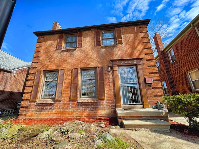 10342 Britain St, Detroit, MI 48224 - view of front of property with a chimney and brick siding