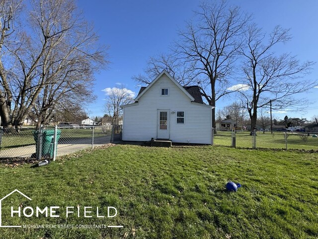 view of property exterior featuring a yard and a fenced backyard