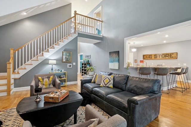 17867 K-Line Way, Marshall, MI 49068 - living room with stairway, baseboards, wood finished floors, and recessed lighting