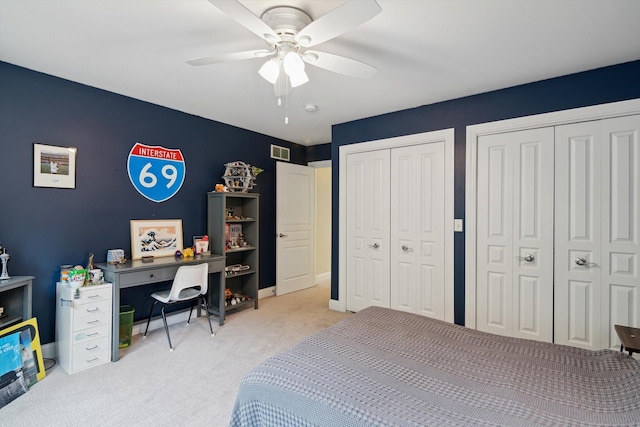 17867 K-Line Way, Marshall, MI 49068 - carpeted bedroom featuring multiple closets, visible vents, and ceiling fan