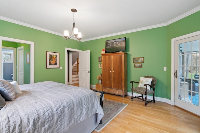 17867 K-Line Way, Marshall, MI 49068 - bedroom with an inviting chandelier, ornamental molding, access to outside, and light wood-type flooring