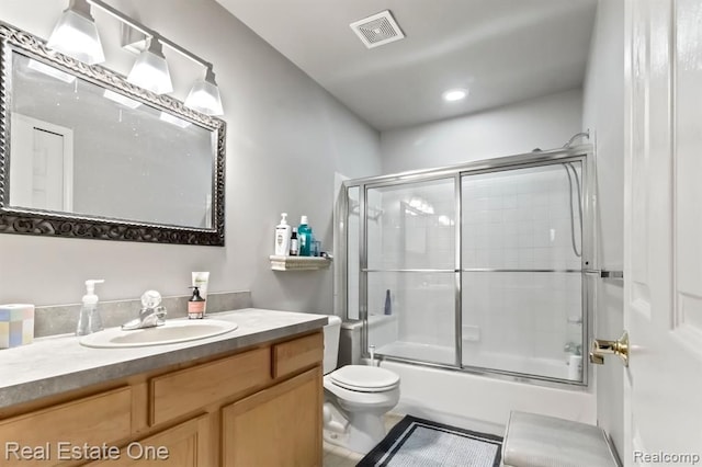 45089 Klingkammer St, Utica, MI 48317 - full bath featuring visible vents, vanity, toilet, tile patterned floors, and enclosed tub / shower combo
