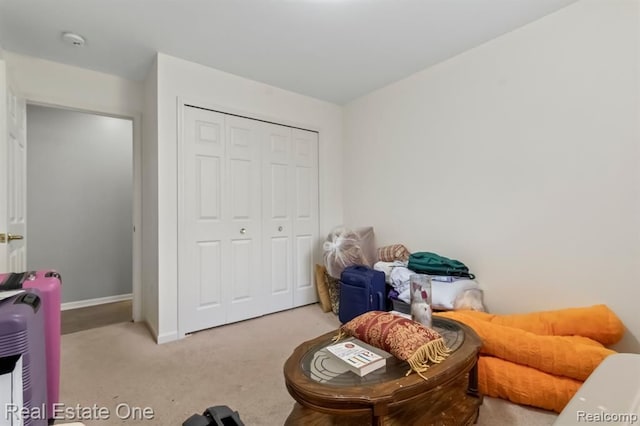 45089 Klingkammer St, Utica, MI 48317 - bedroom with baseboards, light carpet, and a closet