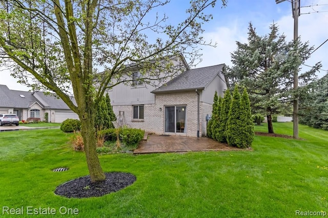 45089 Klingkammer St, Utica, MI 48317 - rear view of house with a lawn, a patio area, and brick siding