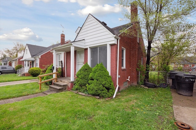 11908 Roxbury St, Detroit, MI 48224 - bungalow-style home with a chimney and brick siding