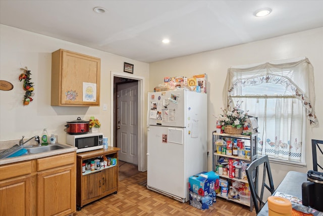 11908 Roxbury St, Detroit, MI 48224 - kitchen featuring white appliances, light countertops, a sink, and recessed lighting