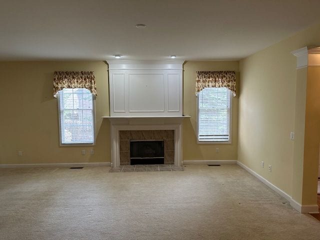 5081 Belmonte Dr, Rochester, MI 48306 - unfurnished living room featuring light carpet, baseboards, and a fireplace