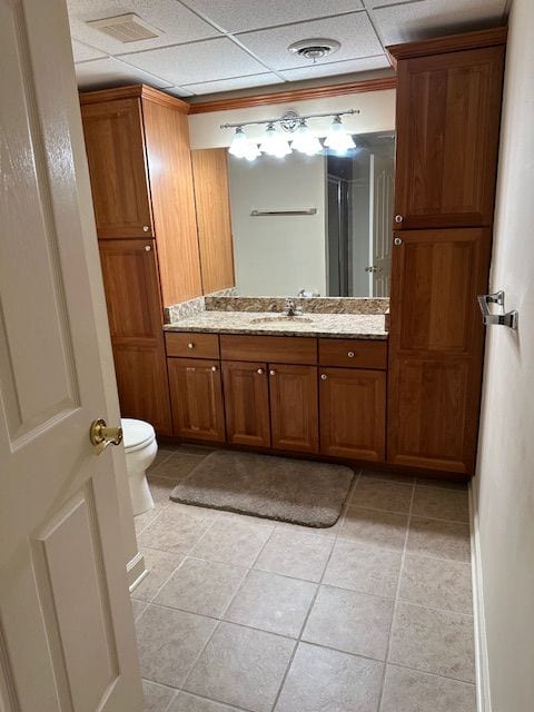 5081 Belmonte Dr, Rochester, MI 48306 - bathroom featuring tile patterned floors, visible vents, vanity, and toilet