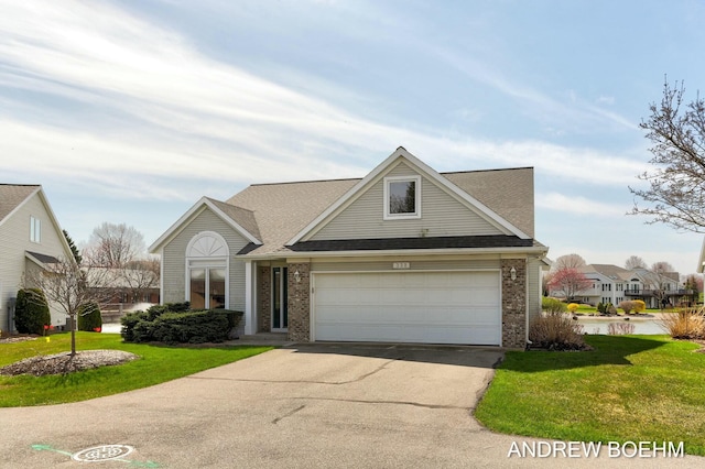 332 Royal Park Dr, Zeeland, MI 49464 - traditional-style home with roof with shingles, driveway, brick siding, a front yard, and a garage