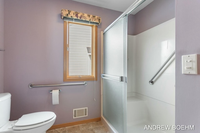 332 Royal Park Dr, Zeeland, MI 49464 - full bath featuring a stall shower, baseboards, visible vents, and toilet