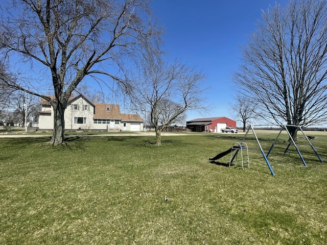 7801 S Lucas Rd, Mcbain, MI 49657 - view of yard featuring driveway and a garage
