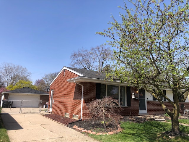 view of property exterior featuring brick siding, crawl space, a garage, and an outdoor structure