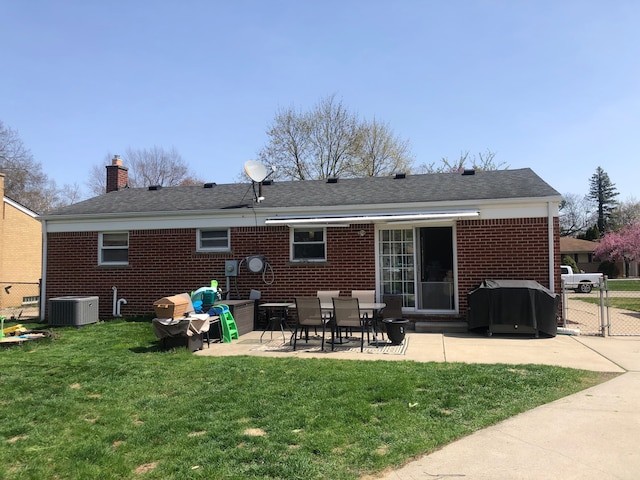 back of house featuring a chimney, a gate, fence, cooling unit, and a patio
