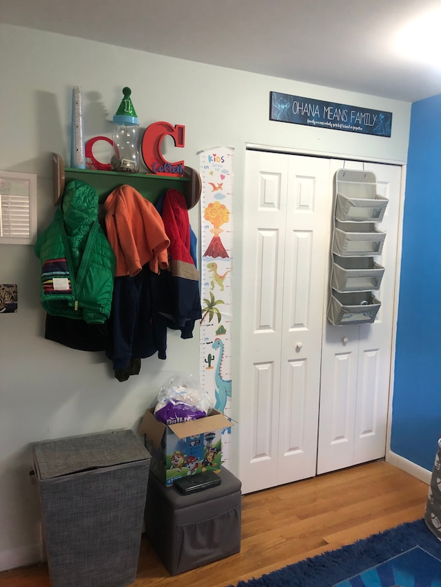 mudroom with wood finished floors