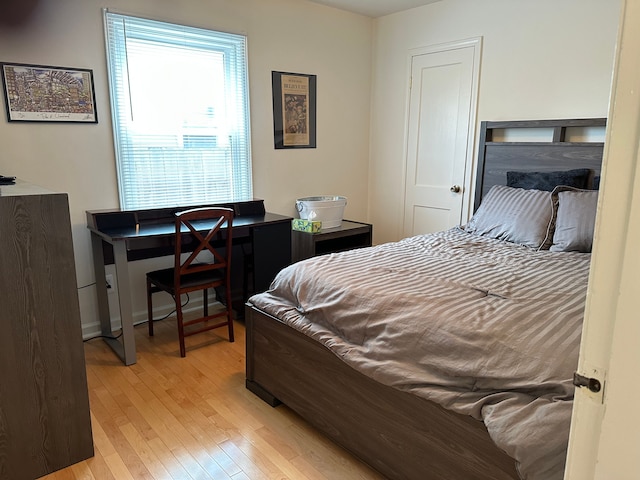 bedroom featuring light wood finished floors