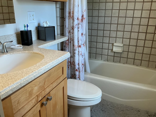 full bathroom featuring shower / bath combo, vanity, and toilet