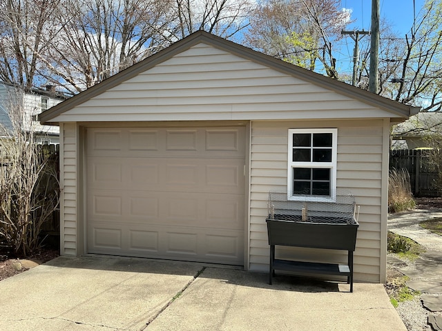 detached garage featuring driveway