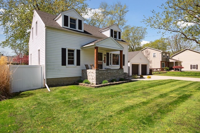 cape cod-style house featuring fence, a shingled roof, a porch, and a front lawn