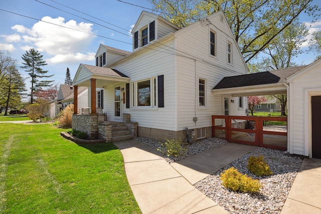 view of home's exterior with a lawn and roof with shingles