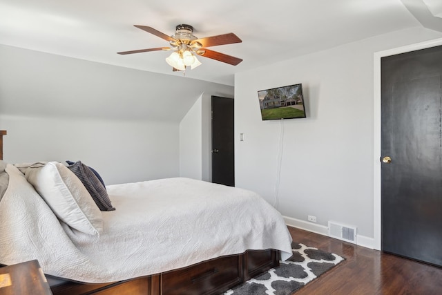 bedroom with ceiling fan, visible vents, wood finished floors, baseboards, and lofted ceiling