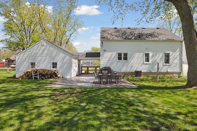 back of house with a yard, a patio, and central AC unit