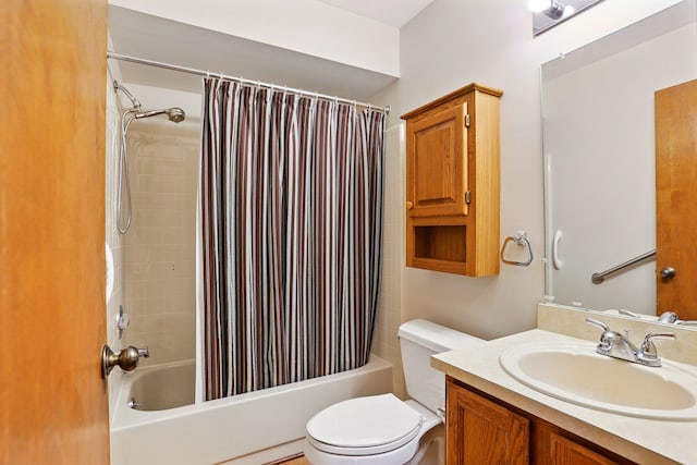 bathroom with shower / tub combo with curtain, vanity, and toilet
