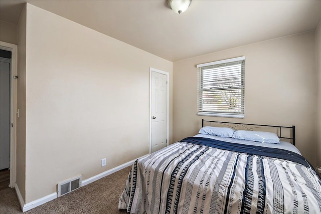 bedroom featuring baseboards, visible vents, and carpet floors