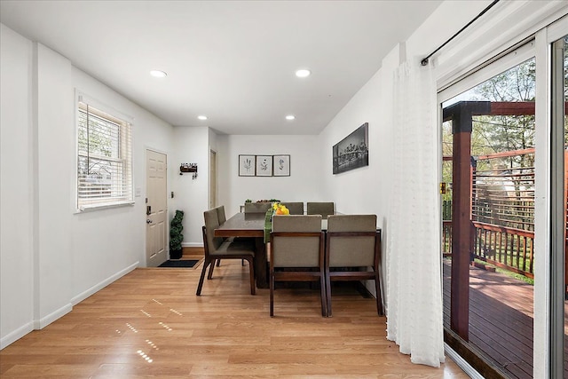 dining space with plenty of natural light, light wood finished floors, and recessed lighting