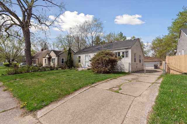 bungalow-style home with a gate