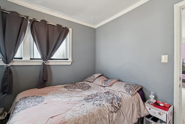 bedroom featuring crown molding