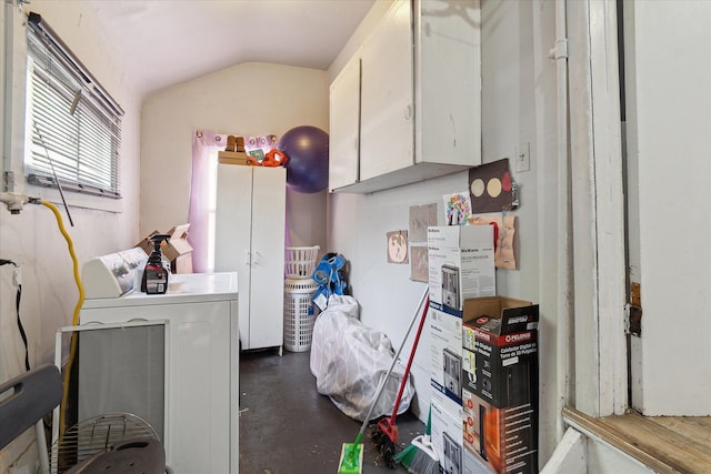 clothes washing area featuring washer / dryer and cabinet space