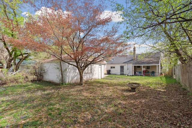 view of yard with an outdoor fire pit