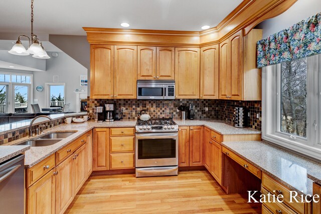 5575 Beechmont Rd, Whitehall, MI 49461 - kitchen with a sink, light wood-type flooring, light stone countertops, appliances with stainless steel finishes, and hanging light fixtures