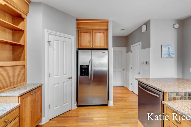 5575 Beechmont Rd, Whitehall, MI 49461 - kitchen with open shelves, appliances with stainless steel finishes, light stone countertops, and light wood-style flooring