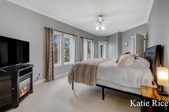 5575 Beechmont Rd, Whitehall, MI 49461 - carpeted bedroom with a ceiling fan, baseboards, crown molding, and a glass covered fireplace