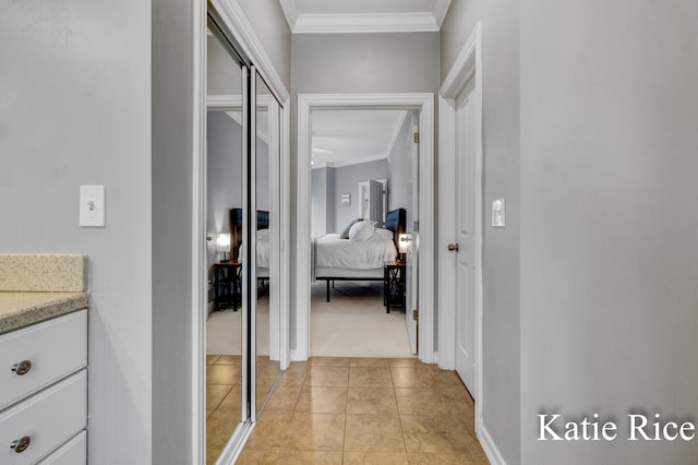 5575 Beechmont Rd, Whitehall, MI 49461 - hallway featuring baseboards, crown molding, light colored carpet, and light tile patterned floors