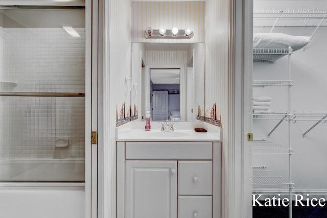 5575 Beechmont Rd, Whitehall, MI 49461 - ensuite bathroom with combined bath / shower with glass door, ensuite bath, and vanity
