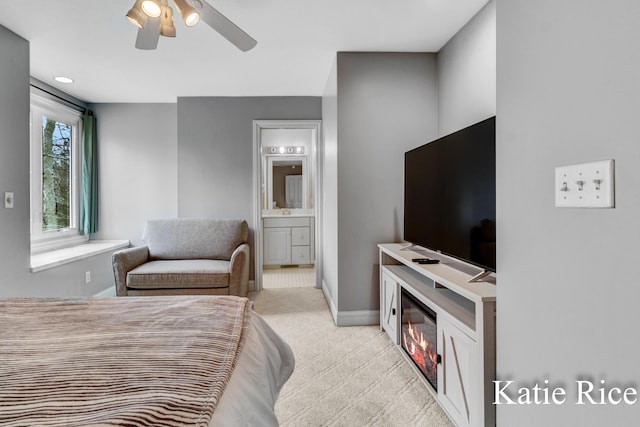 5575 Beechmont Rd, Whitehall, MI 49461 - bedroom with a ceiling fan, baseboards, light carpet, and ensuite bathroom