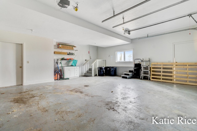5575 Beechmont Rd, Whitehall, MI 49461 - garage featuring a garage door opener