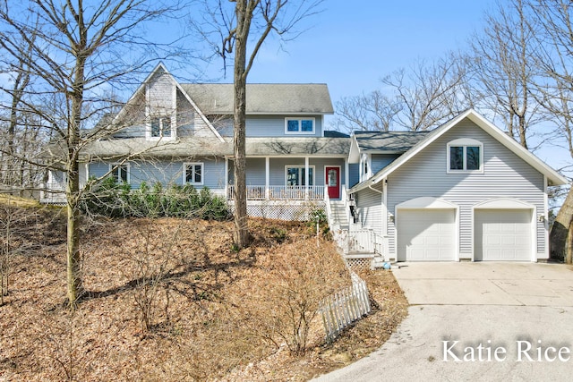 5575 Beechmont Rd, Whitehall, MI 49461 - traditional-style home with stairs, concrete driveway, an attached garage, a porch, and roof with shingles