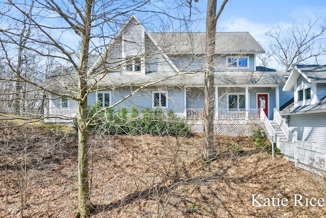 5575 Beechmont Rd, Whitehall, MI 49461 - view of front of home with stairway, a shingled roof, and covered porch