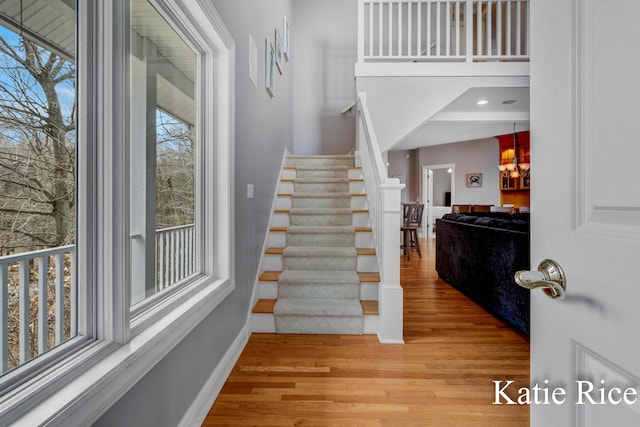 5575 Beechmont Rd, Whitehall, MI 49461 - stairs featuring baseboards and wood finished floors